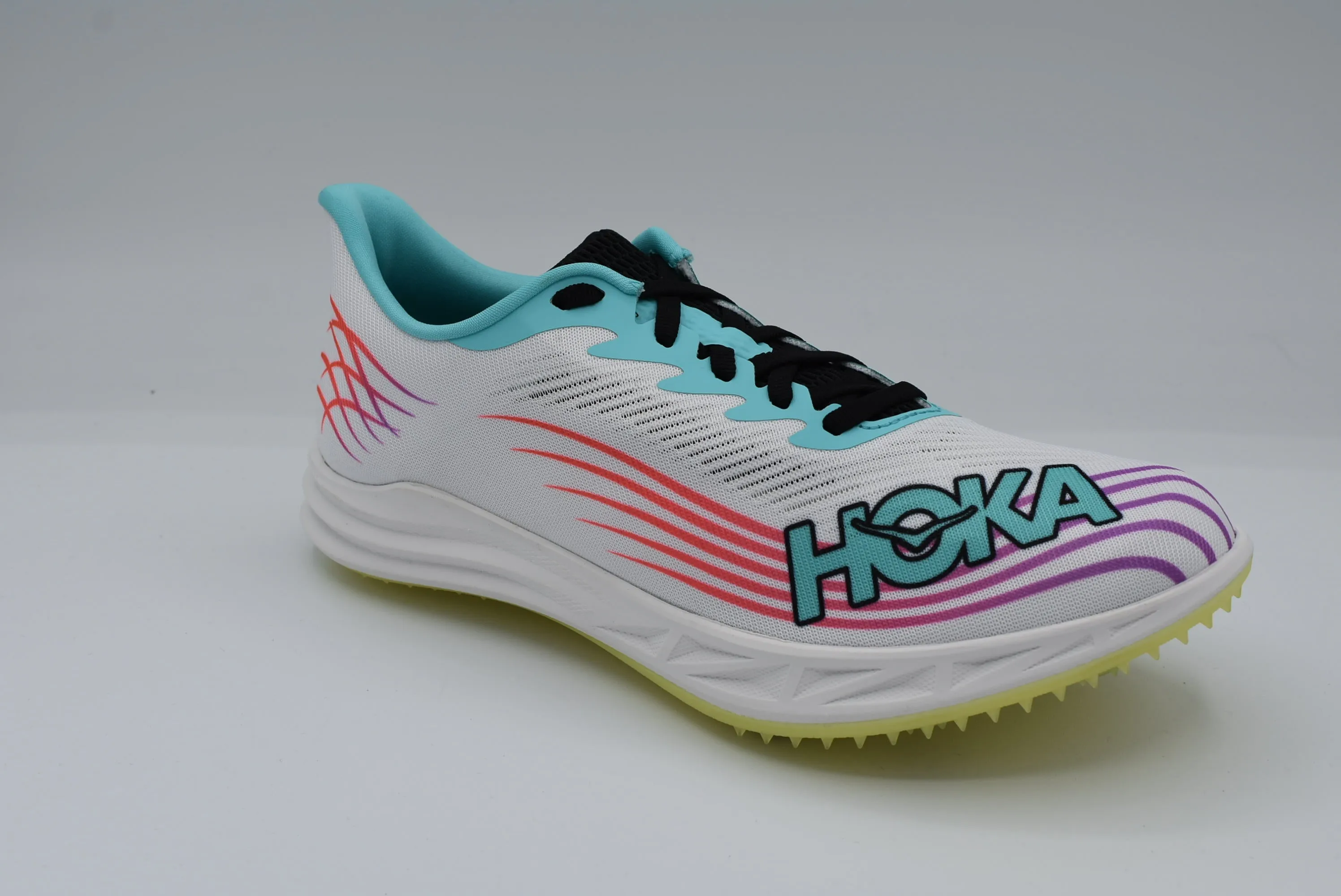 Hoka Crescendo MD 2 Spike running in stadium